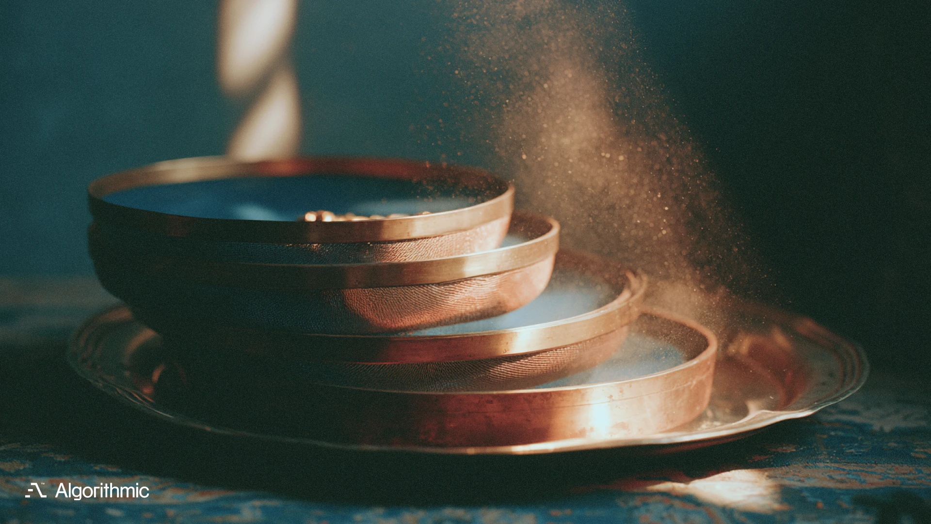 A stack of graduated brass assay sieves catching gold grains as dust falls through, illustrating data cleaning governance for production pipelines.