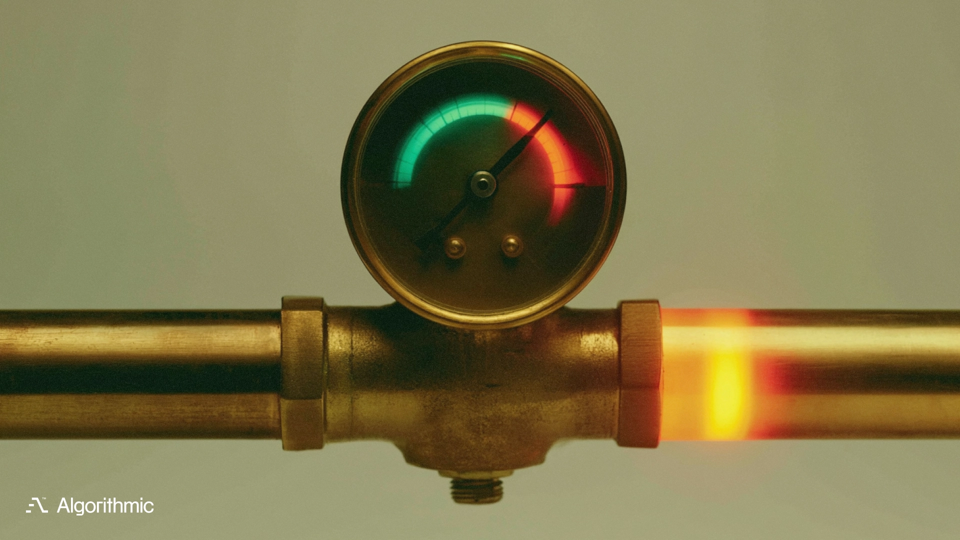 A brass pressure gauge with the needle in the red, illustrating scaling product operations under load before a growth push.